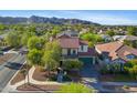 Breathtaking aerial view showcasing the home and its surroundings, with mountain views at 20518 W White Rock Rd, Buckeye, AZ 85396