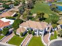 Aerial view of a white two-story home with perfectly manicured landscaping at 3330 S Horizon Pl, Chandler, AZ 85248
