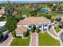 Aerial view of an estate featuring lush landscaping, a golf course, and a lakeside community at 3330 S Horizon Pl, Chandler, AZ 85248