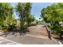 Picturesque community with lush landscaping, trees, and a charming wooden bridge at 4648 N 40Th St, Phoenix, AZ 85018