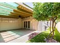 Back patio with a beam overhead, grass, and access to the house at 6025 N 10Th Pl, Phoenix, AZ 85014