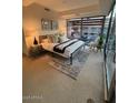 Bright bedroom with large windows, a comfortable bed, and stylish decor at 7151 E Rancho Vista Dr # 6002, Scottsdale, AZ 85251