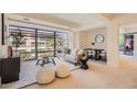 Contemporary living room featuring a comfortable sofa, stylish decor, and large windows at 7151 E Rancho Vista Dr # 6002, Scottsdale, AZ 85251