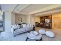 Open-concept living room with adjacent kitchen, neutral decor, and comfortable seating arrangement at 7151 E Rancho Vista Dr # 6002, Scottsdale, AZ 85251
