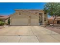 Charming two-story home with a three car garage and desert landscaping at 7923 W Hess Ave, Phoenix, AZ 85043