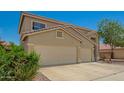 Charming two-story home with a three car garage and desert landscaping at 7923 W Hess Ave, Phoenix, AZ 85043
