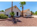 Side view of a home with desert landscaping and a two-car garage in a quiet neighborhood at 10029 S 44Th St, Phoenix, AZ 85044