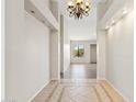Inviting hallway with decorative tile, recessed lighting, and neutral wall paint at 1192 E Sunset Dr, Casa Grande, AZ 85122