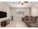 Comfortable living room with tile flooring, ceiling fan and natural light at 125 N Sunvalley Blvd # 119, Mesa, AZ 85207