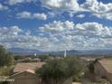 Expansive scenic view from the home overlooking mountains and desert landscape under cloudy skies at 12852 N Mountainside Dr # 2, Fountain Hills, AZ 85268