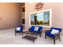 Covered patio featuring comfortable seating and a view of the surrounding landscape at 15792 W Desert Mirage Dr, Surprise, AZ 85379