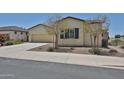 Inviting single-story home with well-maintained landscaping, a two-car garage, and a serene neighborhood setting at 17082 S 182Nd Ave, Goodyear, AZ 85338