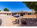 Charming single story home with brick facade, desert landscaping and a two car garage at 1804 S Standage Cir, Mesa, AZ 85202