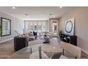 Bright living room featuring modern furnishings, hardwood floors, and large windows for natural light at 2121 W Sonoran Desert Dr # 45, Phoenix, AZ 85085