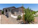 Charming single-story home with well-maintained desert landscaping and inviting entry at 23112 E Twilight Dr, Queen Creek, AZ 85142