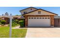 Front exterior showcasing a two-story home with a two car garage with a concrete driveway and manicured front lawn at 2547 W Naranja Ave, Mesa, AZ 85202