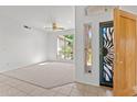 Bright entryway featuring decorative door and window with views to the front yard at 31234 N 47Th Pl, Cave Creek, AZ 85331