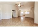 The living room features tile flooring, a ceiling fan, and open access to the kitchen at 3750 S Conestoga Rd, Apache Junction, AZ 85119