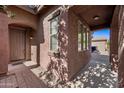 Covered front porch, offering a sheltered entrance with views of the neighborhood at 3850 E Geronimo St, Gilbert, AZ 85295