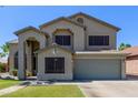 A charming two-story home with neutral stucco, tile roof, desert landscaping, and two-car garage at 4331 E Redwood Ln, Phoenix, AZ 85048