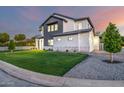 Beautiful two-story house with a modern design, green lawn, and attractive landscaping at 4813 E Earll Dr, Phoenix, AZ 85018