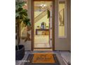 Inviting entryway featuring a decorative rug and view of the staircase at 7616 S Sorrell Ln, Gilbert, AZ 85298