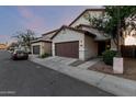 A pleasing street view of the home featuring desert landscaping at 10225 W Camelback Rd # 33, Phoenix, AZ 85037