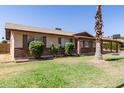 Single-story home featuring a combination of brick and siding, complemented by well-maintained landscaping at 1263 W Del Rio St, Chandler, AZ 85224