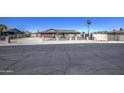 Charming single-story home with a brown tile roof, desert landscaping, and a secure front fence at 1911 N 42Nd Ave, Phoenix, AZ 85009