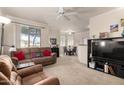 This spacious living room features neutral carpet and convenient dining space at 1941 S Pierpont Dr # 1037, Mesa, AZ 85206