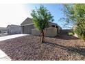 Beige home with desert landscaping at 3704 E Haflinger Rd, San Tan Valley, AZ 85140