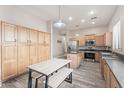 Eat-in kitchen boasts stainless appliances, center island, and lots of cabinets for storage at 4667 E County Down Dr, Chandler, AZ 85249