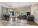 Inviting living room showcasing wood floors, neutral paint, and a glimpse into a cozy adjacent living space at 4667 E County Down Dr, Chandler, AZ 85249