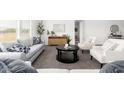 Bright and airy living room showcasing contemporary design, neutral colors, and comfortable, stylish furniture at 10284 E Shallow Canyon Rd, San Tan Valley, AZ 85143