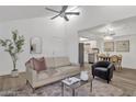 Bright living room with modern decor flowing into the dining and kitchen areas at 1075 E Chandler Blvd # 212, Chandler, AZ 85225