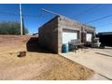 View of the detached two-car garage with brick accents and ample storage space at 2133 W Wilshire Dr, Phoenix, AZ 85009
