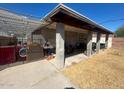 Covered patio area with sturdy support columns and ample space for outdoor relaxation and entertainment at 2133 W Wilshire Dr, Phoenix, AZ 85009