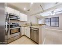 The kitchen has stainless steel appliances and granite countertops at 2301 E University Dr # 210, Mesa, AZ 85213
