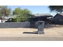 Charming home featuring a private front yard and a convenient carport at 265 W 17Th Ave, Apache Junction, AZ 85120