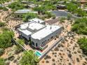 Home featuring a pool, desert landscaping, and backyard patio at 32826 N 54Th St, Cave Creek, AZ 85331