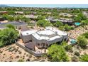 Expansive backyard with patio area, pergola, sparkling pool, and desert landscaping at 32826 N 54Th St, Cave Creek, AZ 85331