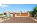 Home featuring desert landscaping and a multi-car garage at 32826 N 54Th St, Cave Creek, AZ 85331