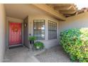 Cozy entryway featuring a red door, stylish plants, and a welcoming ambiance at 6017 E Kathleen Rd, Scottsdale, AZ 85254