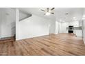 Open-concept living space featuring a ceiling fan and luxury vinyl plank flooring at 6537 W Pioneer St, Phoenix, AZ 85043