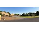 Home featuring a spacious driveway and well-manicured lawn at 661 W Via De Palmas --, San Tan Valley, AZ 85140