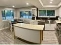 Bright kitchen with an island, stainless steel appliances, and lots of natural light at 753 W 6Th Dr, Mesa, AZ 85210