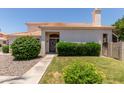 A charming home with a tiled roof, and a neatly landscaped front lawn at 7621 S Bonarden Ln, Tempe, AZ 85284