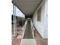 View of an accessible home entrance featuring a ramp and carport at 11596 W Sierra Dawn Blvd # 372, Surprise, AZ 85378