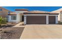 Charming single-story home features a well-manicured front yard and a spacious two-car garage at 11622 W Palm Brook Dr, Avondale, AZ 85392