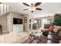 Spacious living room features tile floors, a ceiling fan, and an open layout at 1401 E Puget Ave # 10, Phoenix, AZ 85020